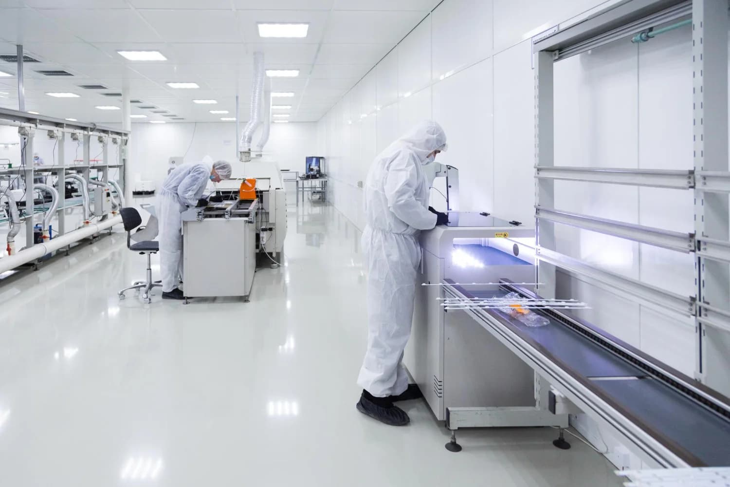 Technicians at work in the US Compounding Factory cleanroom